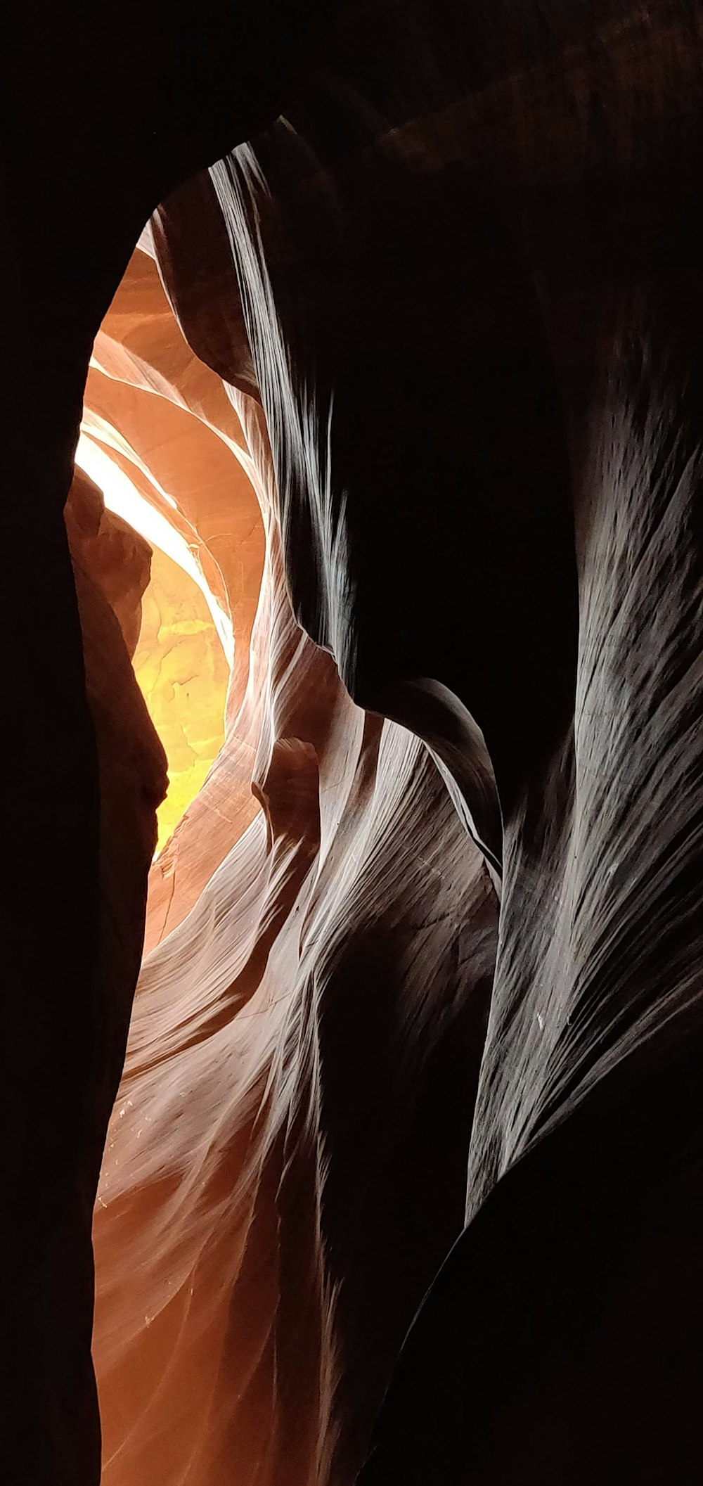 a narrow slot in the side of a canyon