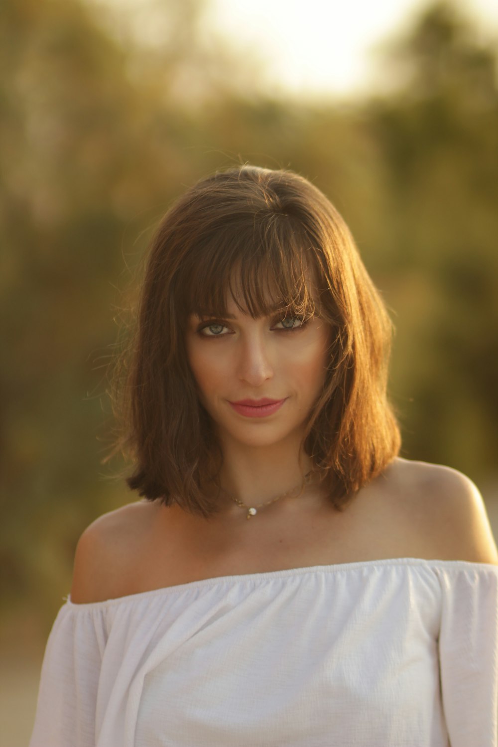 woman in a white off shoulder top