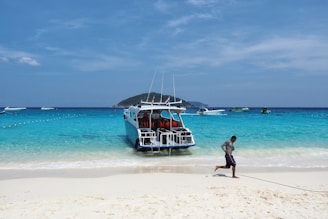 Modern speedboat docked at a Maldivian pier ready for passengers.