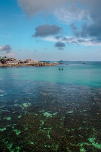 a body of water that has some rocks in it