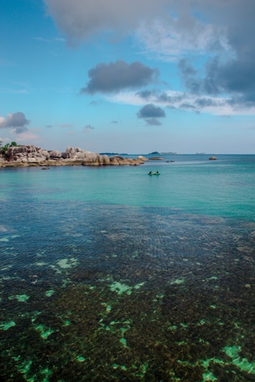 a body of water that has some rocks in it