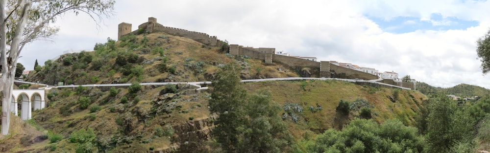 a large hill with a castle on top of it