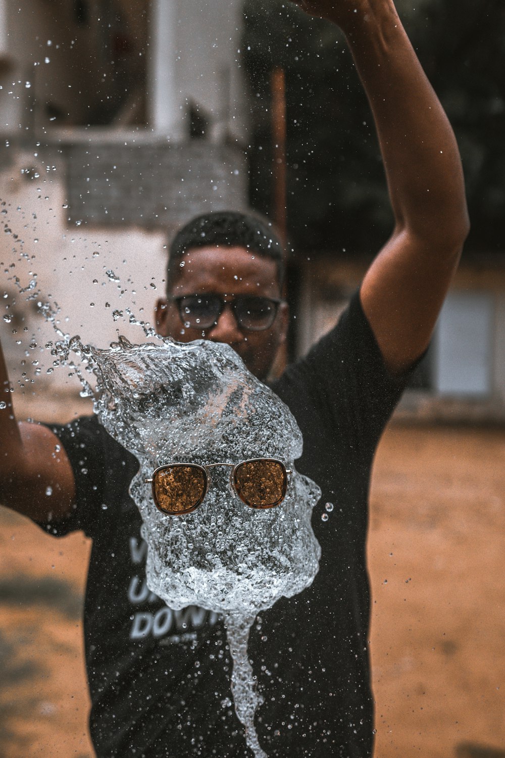 man playing water outside