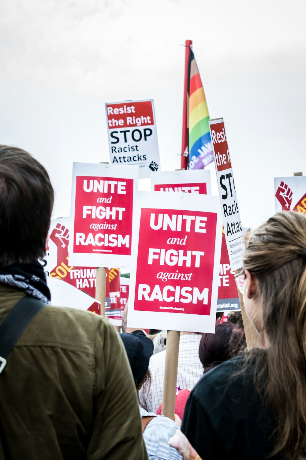 a group of people holding signs in a protest