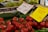 A vibrant display of fresh fruits and vegetables at a local market stall.