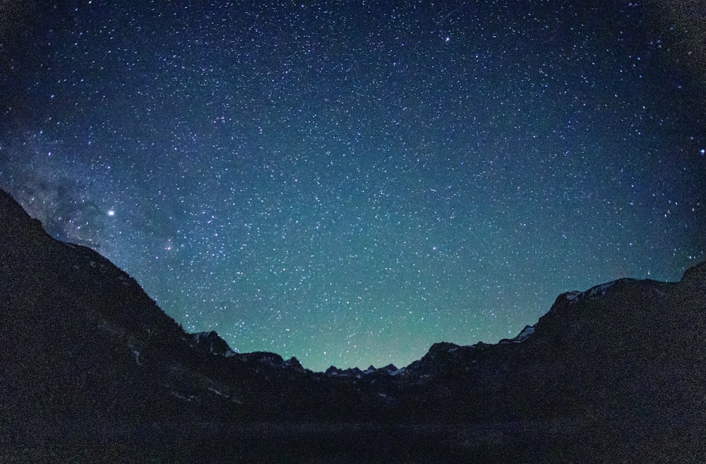 mountains under starry sky