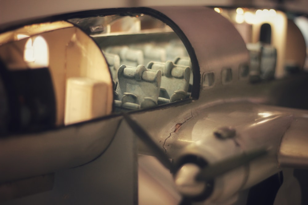 a close up of a mirror on a plane