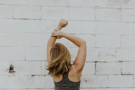 woman wearing grey racerback top