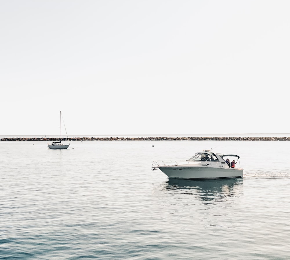 white boat on water