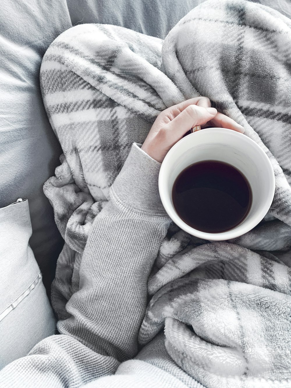 black liquid in white ceramic mug