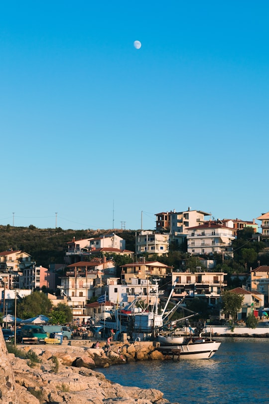 white painted houses near body of water in Thassos Greece