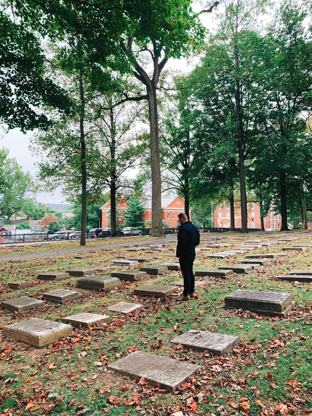 man standing near tomb