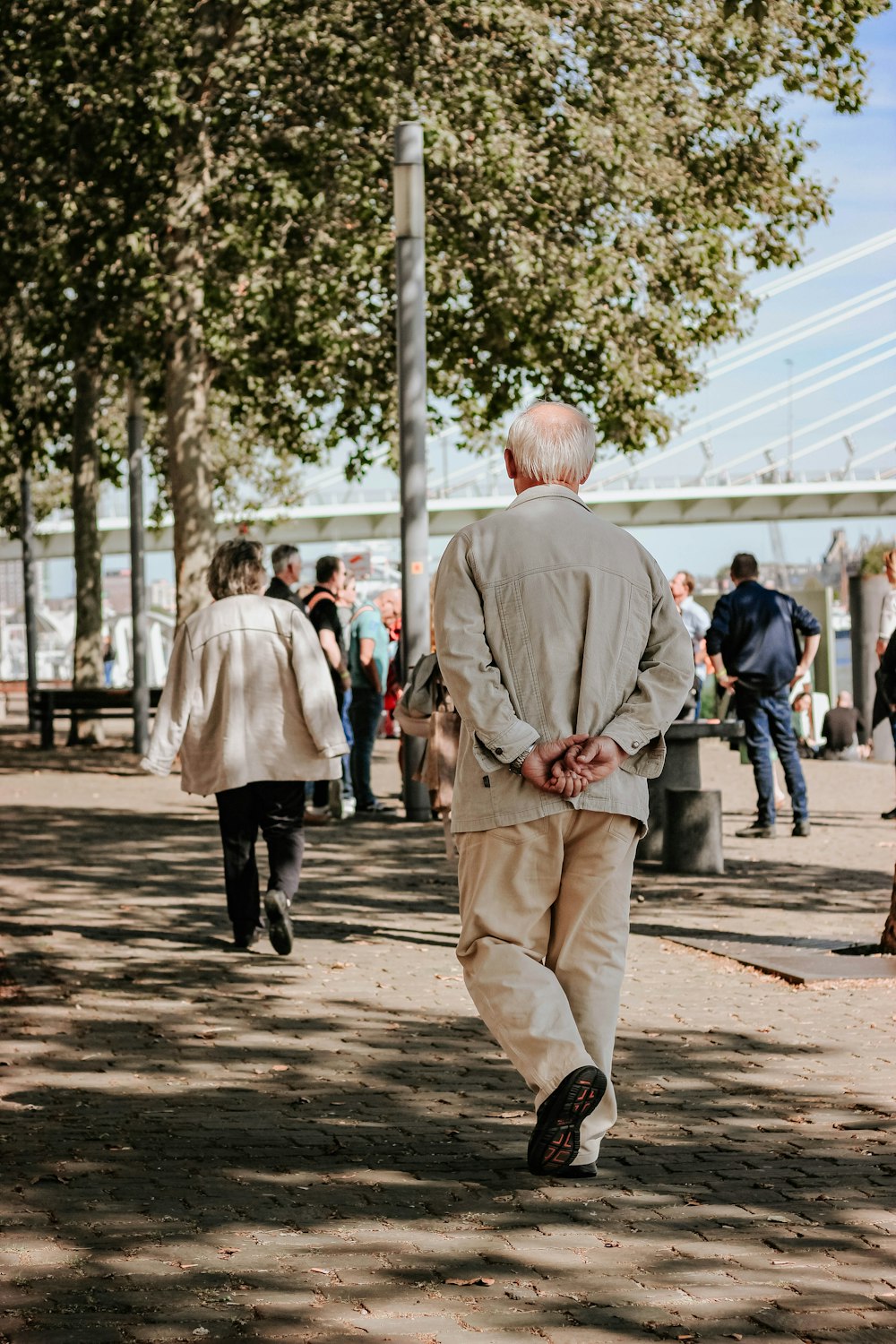 man walking near trees