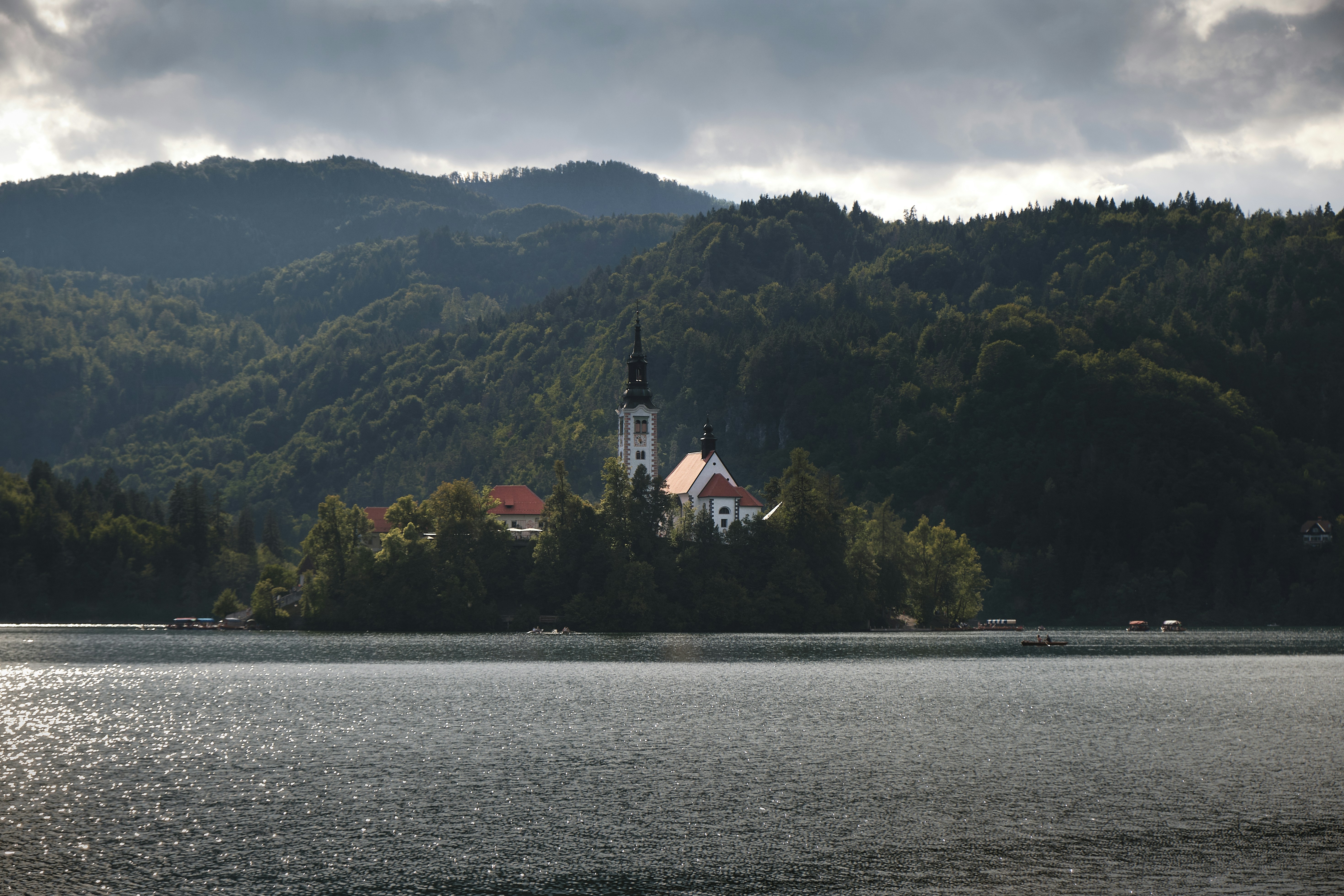 a church on a small island in the middle of a lake