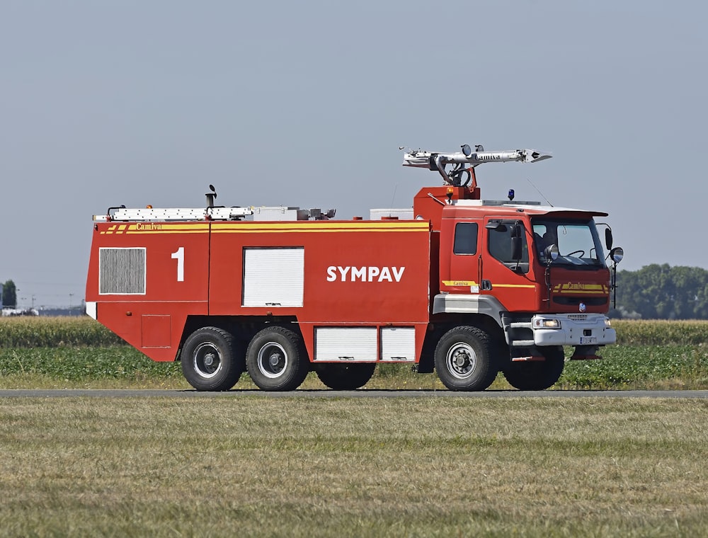 red Sympav 1 firetruck near green field