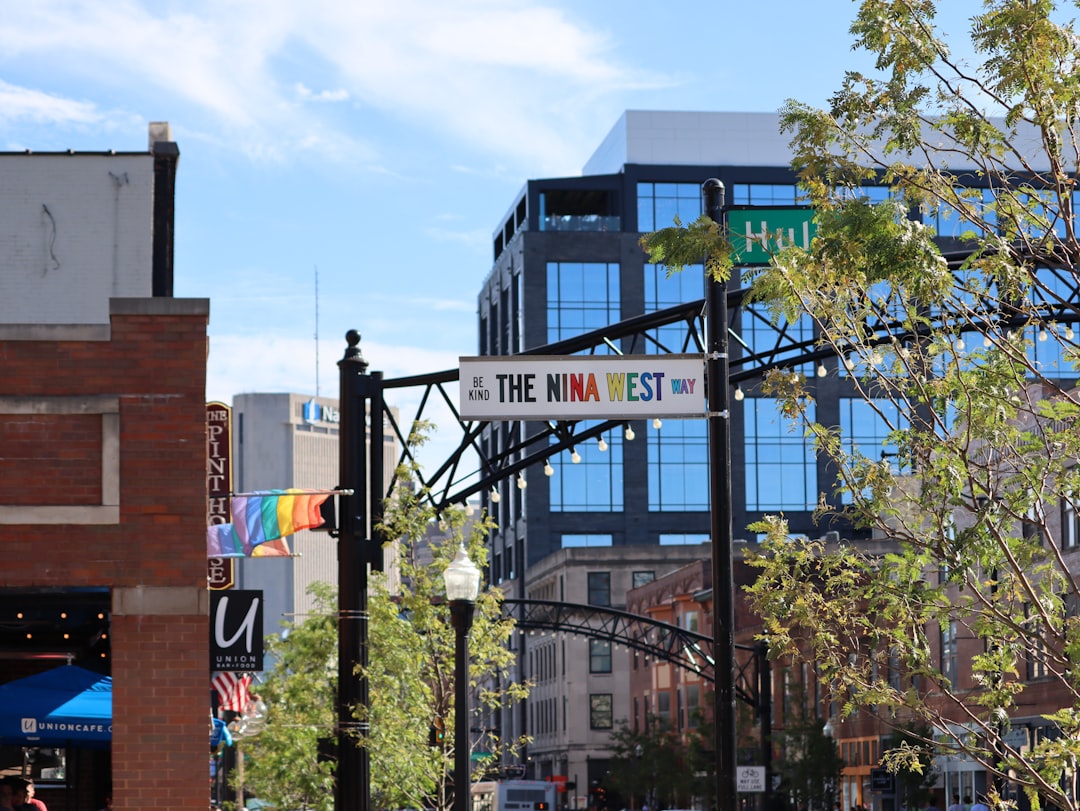 a street sign on a pole on a city street