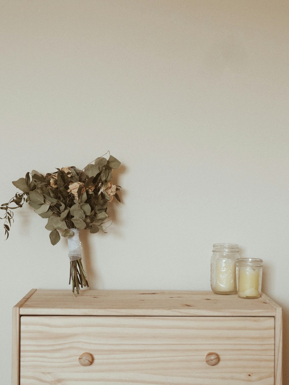 two clear jars on desk