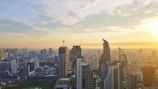 A panoramic city skyline at sunset symbolizing global economic activity.