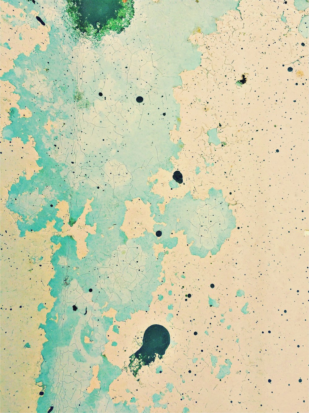 an abstract painting of blue and green paint