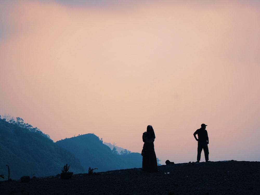 silhouette photography of man and woman