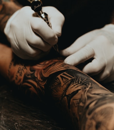 person doing tattoo