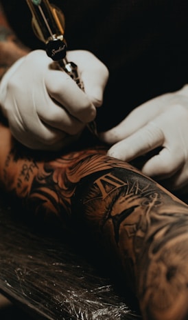 person doing tattoo