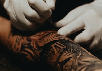 person doing tattoo