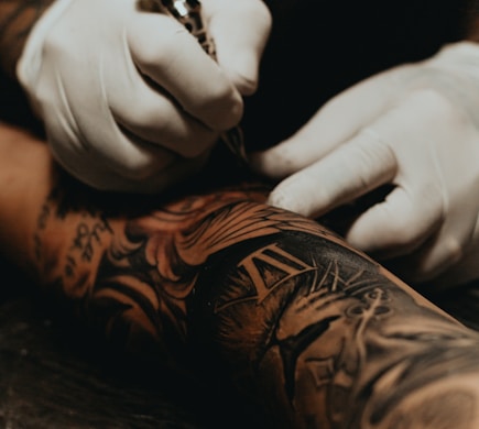 person doing tattoo