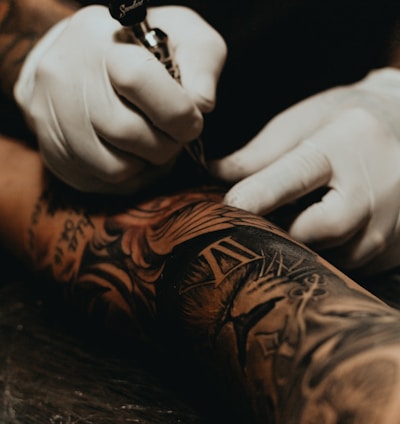 person doing tattoo