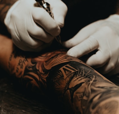 person doing tattoo