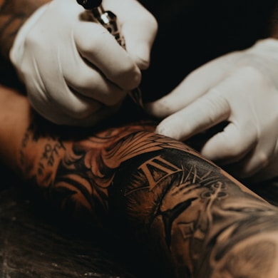 person doing tattoo