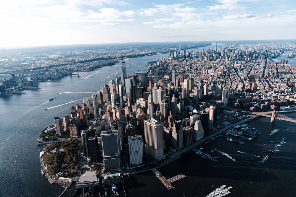 aerial view of buildings beside body of water during daytime