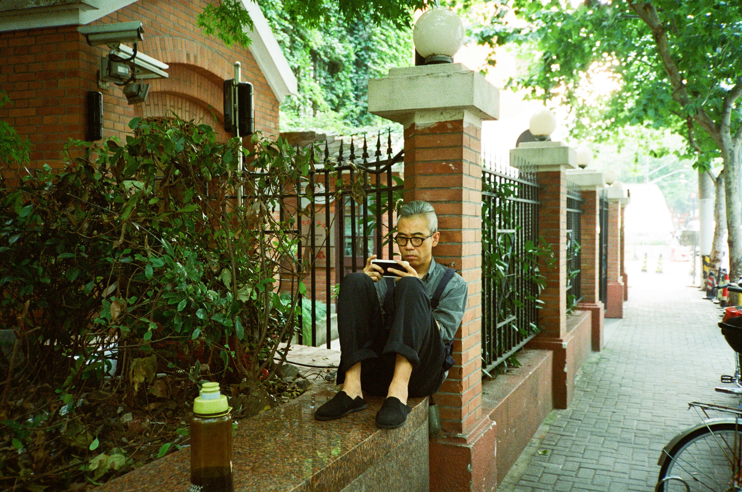man sitting on a fence