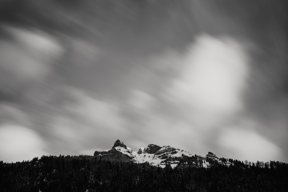 rock mountain covered with snow