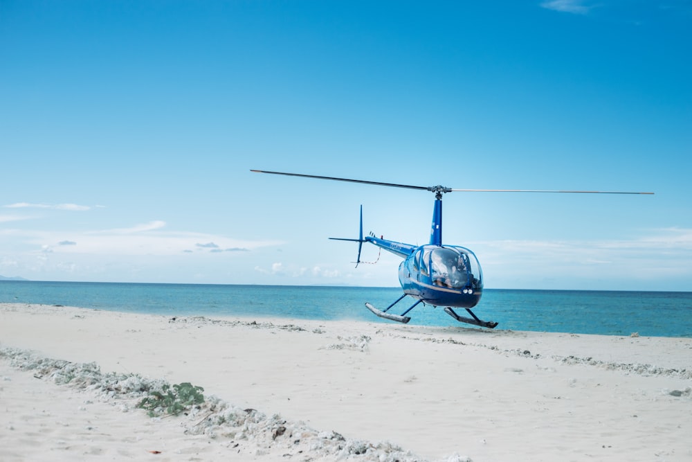 blue and black helicopter at daytime close-up photography