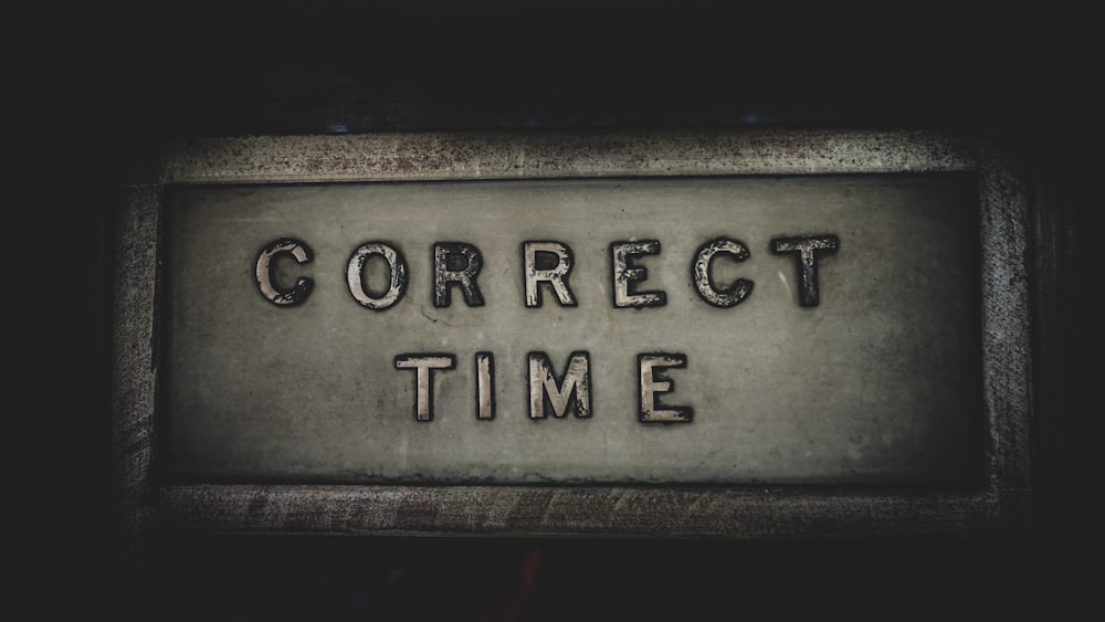 a sign that says correct time on it