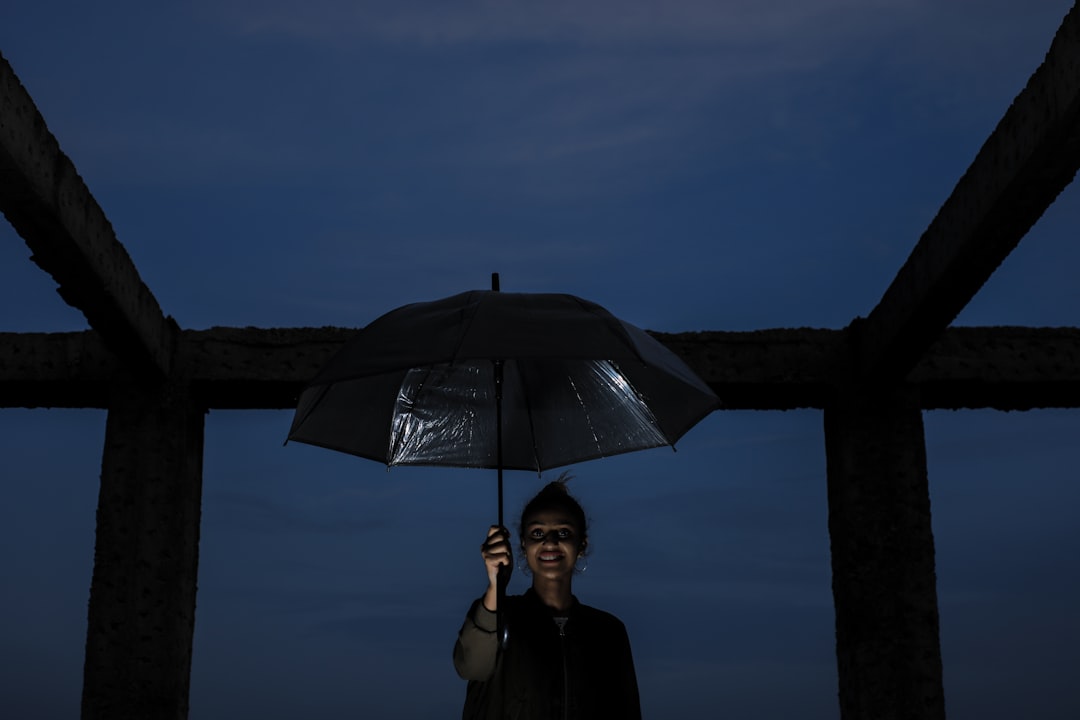 woman holding umbrella