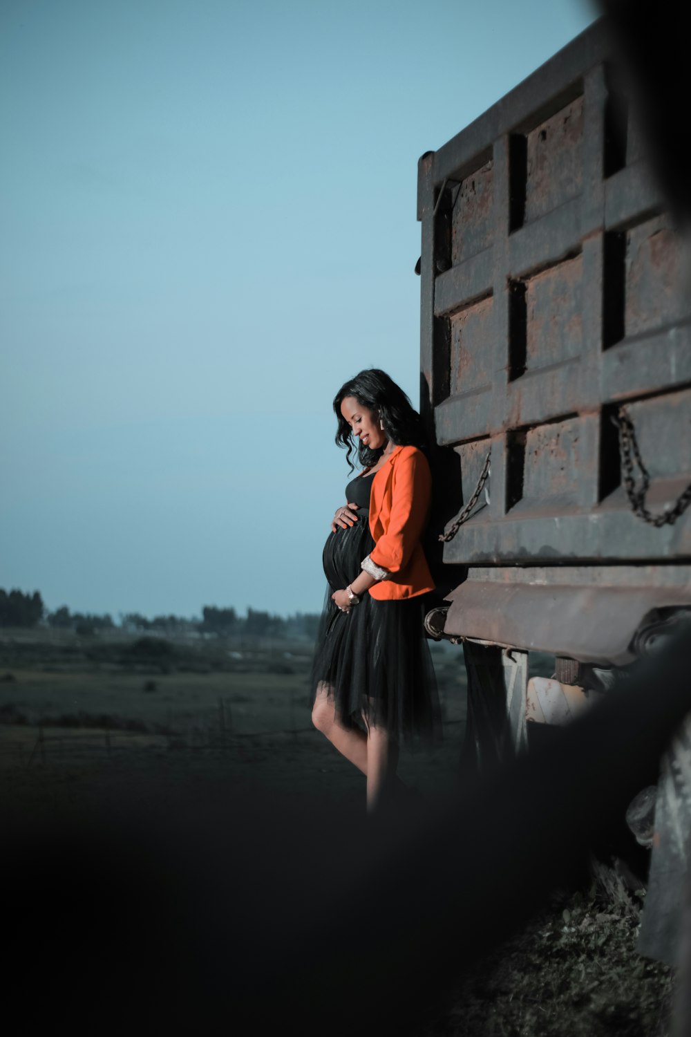 woman leaning on truck