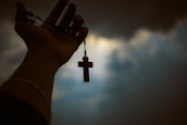 person holding rosary