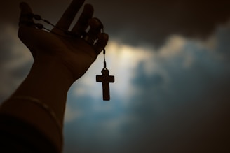 person holding rosary