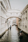 body of water between buildings at daytime
