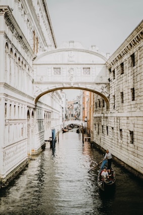 body of water between buildings at daytime