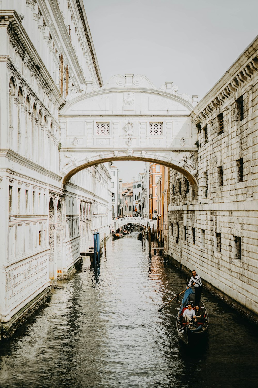 body of water between buildings at daytime