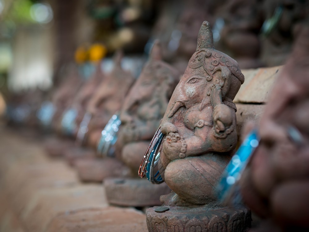 a row of statues of elephants on display