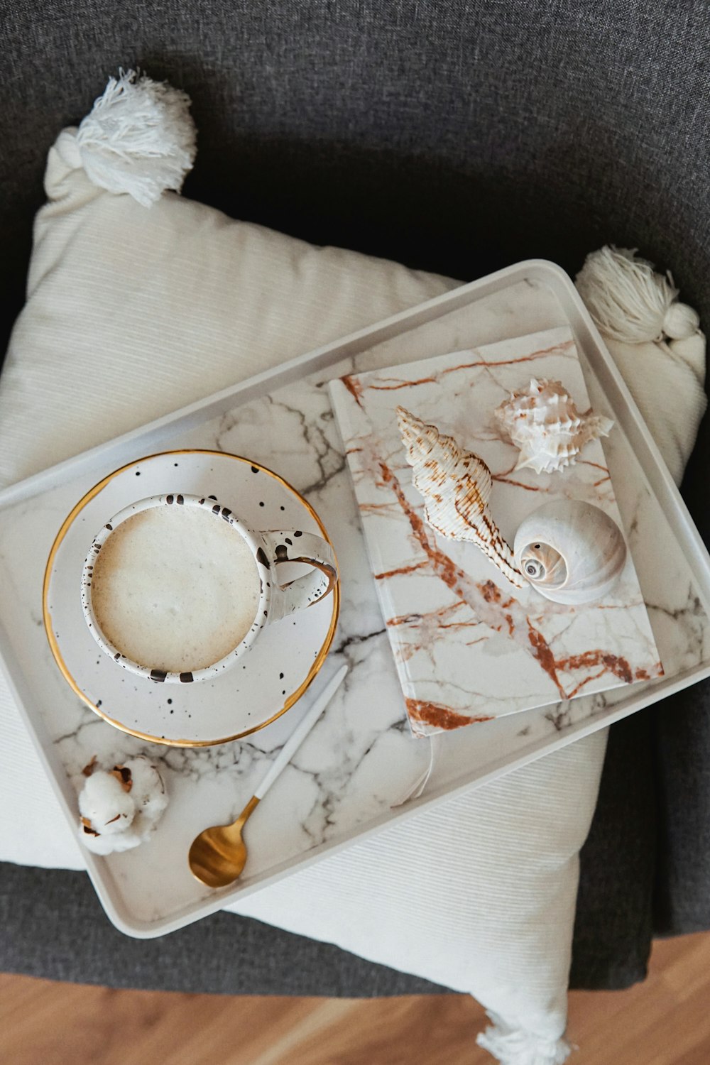 a tray with a cup and saucer on it