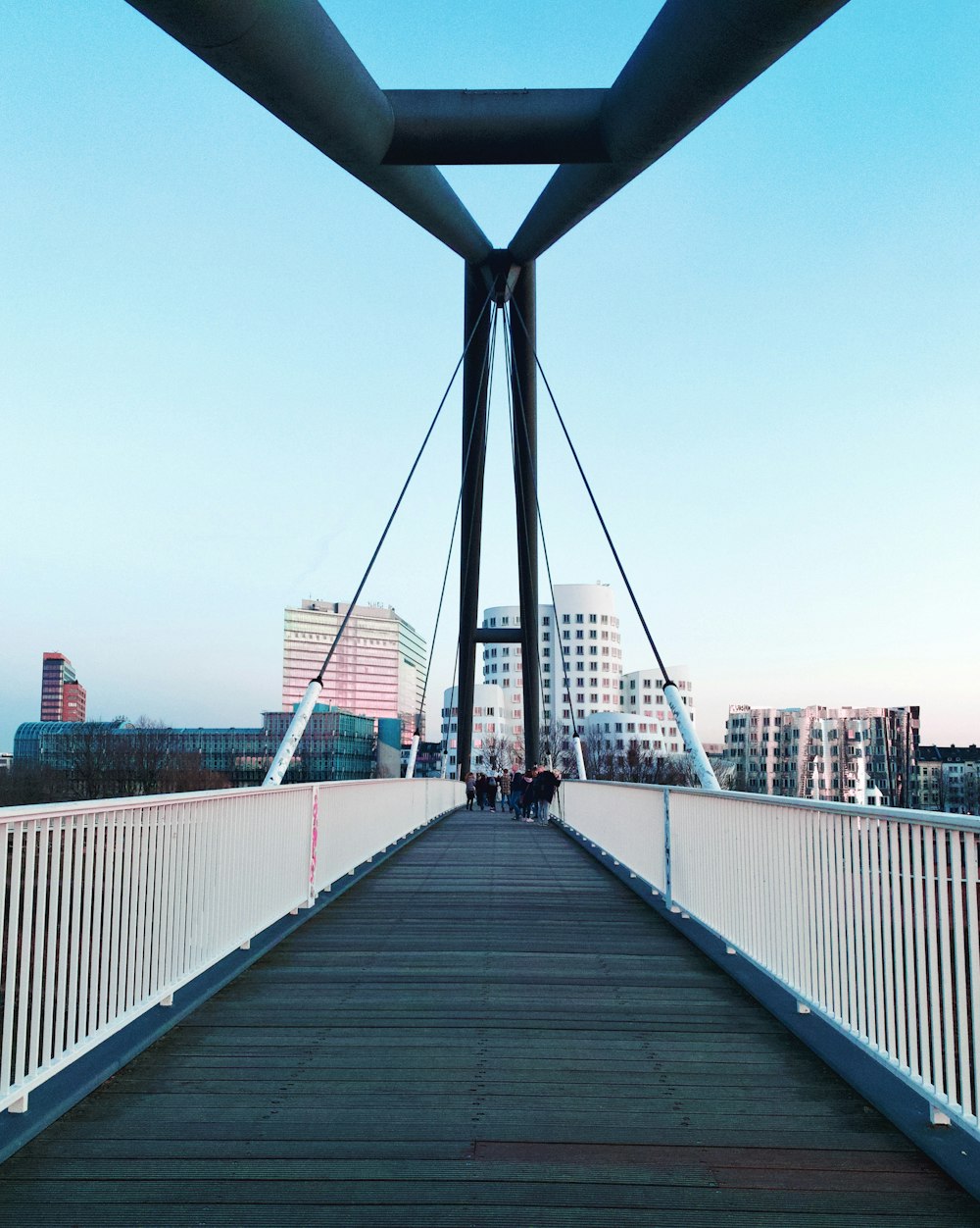 bridge near building during daytime photo