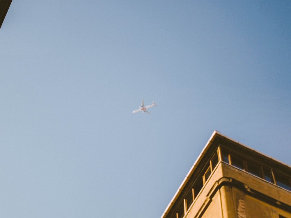 low angle photography of airplane during daytime