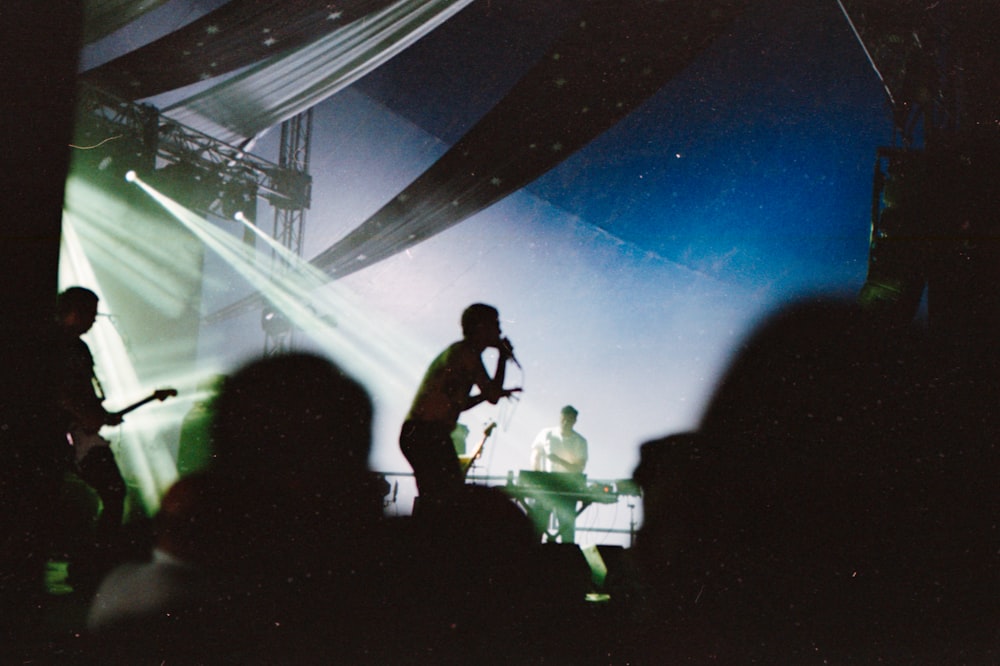 standing man singing on stage