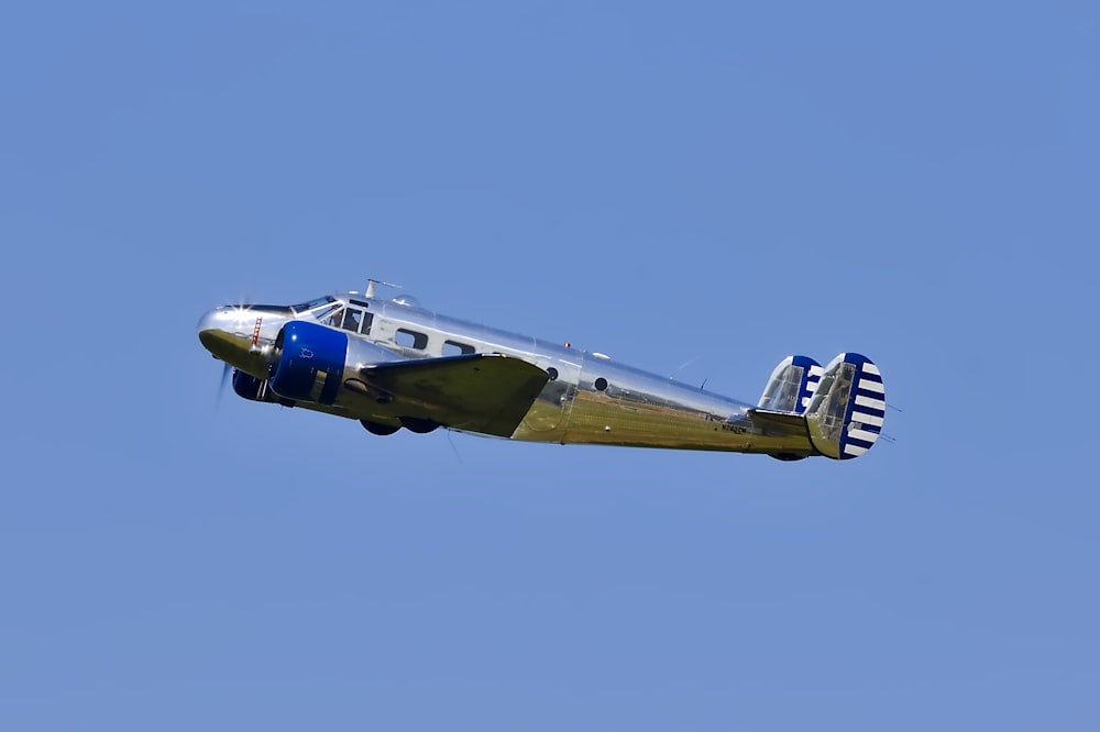 flying blue and gray plane