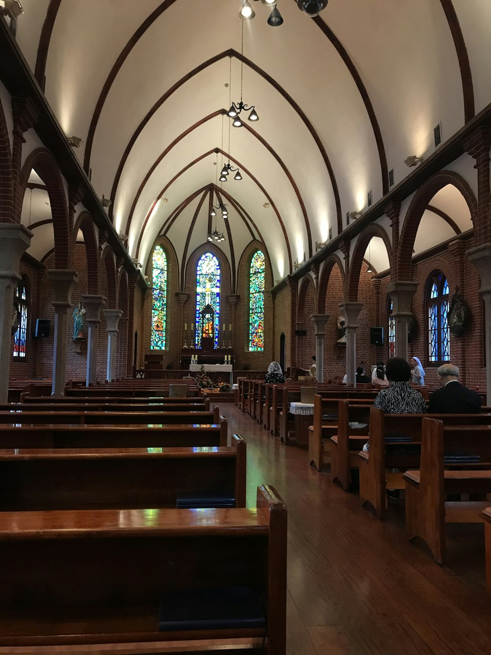 several people inside brown church